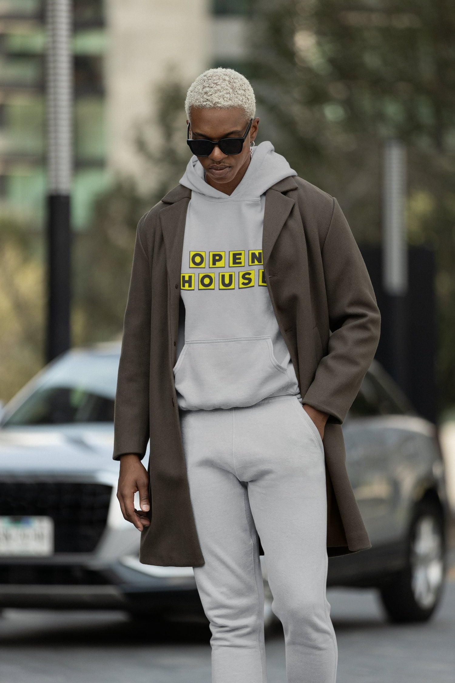 Woman wearing Own The Block sweatshirt